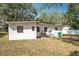 Backyard of the house, showing the AC unit and the green trash can at 213 James Dr, Winter Garden, FL 34787