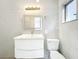 Bright bathroom featuring a modern vanity, a sleek faucet and an illuminated mirror at 213 James Dr, Winter Garden, FL 34787