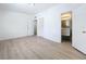 This bedroom showcases wood-look floors, a closet, and an ensuite bathroom at 213 James Dr, Winter Garden, FL 34787