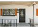 Front entrance of the property, showcasing the door, lantern, and orange shutters at 213 James Dr, Winter Garden, FL 34787