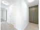 Bright hallway with modern black and gold accents, neutral walls, and wood-look floors at 213 James Dr, Winter Garden, FL 34787