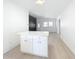 Bright living room featuring an island with white cabinets and light countertops at 213 James Dr, Winter Garden, FL 34787