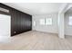 Open living area with modern floors, white walls, and a doorway to another room at 213 James Dr, Winter Garden, FL 34787