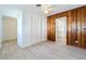 Cozy living room featuring wood paneling, a ceiling fan, and easy access to the kitchen at 213 James Dr, Winter Garden, FL 34787