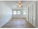 Inviting living room with natural light, a ceiling fan, and ample closet space at 213 James Dr, Winter Garden, FL 34787