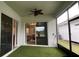 Screened patio with artificial grass flooring at 2132 Limestone Trl, Kissimmee, FL 34747