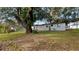 The backyard features a large tree with ample shade at 25 N Van Buren Ave, Orlando, FL 32811