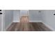 The hallway includes new wood flooring and light gray walls at 25 N Van Buren Ave, Orlando, FL 32811