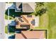 Aerial perspective of a residence featuring solar panels on the roof and well-kept landscaping at 259 Southbridge Cir, Kissimmee, FL 34744