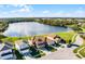 Aerial shot showcasing the home, its landscaped yard, and the serene lake view at 259 Southbridge Cir, Kissimmee, FL 34744