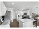 Well-lit kitchen showcasing a white countertop island and stainless steel appliances at 259 Southbridge Cir, Kissimmee, FL 34744