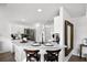 Modern kitchen featuring a white marble countertop island with seating for two at 259 Southbridge Cir, Kissimmee, FL 34744