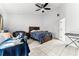 Bedroom featuring tile floors, a queen bed, and contemporary furnishings at 2957 Birmingham Blvd, Orlando, FL 32829