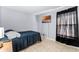 Bedroom featuring tile floors, a twin bed, dark curtains and a TV at 2957 Birmingham Blvd, Orlando, FL 32829