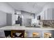 Kitchen featuring stainless steel appliances, a breakfast bar, and tile backsplash at 2957 Birmingham Blvd, Orlando, FL 32829