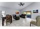 Bright living room with tile floors, vaulted ceiling, and sliding door to outdoor space at 2957 Birmingham Blvd, Orlando, FL 32829