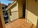 Spacious balcony with tile floors, black metal railing and natural light at 3008 Parkway Blvd # 302, Kissimmee, FL 34747