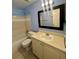 Traditional bathroom featuring a shower-tub combo and vanity at 3008 Parkway Blvd # 302, Kissimmee, FL 34747