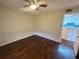 Bedroom featuring hardwood floor, neutral walls, and ceiling fan at 3008 Parkway Blvd # 302, Kissimmee, FL 34747