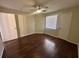 Bedroom with hardwood flooring, natural light, and ample closet space at 3008 Parkway Blvd # 302, Kissimmee, FL 34747