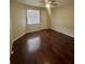 Bedroom features dark hardwood floor, neutral walls, and natural light at 3008 Parkway Blvd # 302, Kissimmee, FL 34747