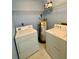 Dedicated laundry room with washer, dryer, and water heater at 3008 Parkway Blvd # 302, Kissimmee, FL 34747