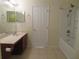 Bathroom with a single sink vanity and a shower-tub combo at 318 Habitat Way, Sanford, FL 32773