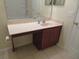 Bathroom featuring a wooden single sink vanity and tile floors at 318 Habitat Way, Sanford, FL 32773