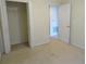 Bedroom featuring closet and ensuite bathroom at 318 Habitat Way, Sanford, FL 32773