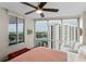 Bright bedroom with large windows offering city and lake views, hardwood floors and comfortable seating at 322 E Central Blvd # 1612, Orlando, FL 32801