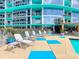 Lounge chairs line the pool deck of this luxury condo at 322 E Central Blvd # 1612, Orlando, FL 32801