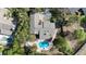 Bird's eye view of a home and property with a pool, spa and fire pit at 4124 Winderlakes Dr, Orlando, FL 32835