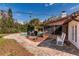 Outdoor space featuring a covered patio with rocking chairs and a pool at 4124 Winderlakes Dr, Orlando, FL 32835