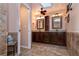 Bathroom featuring dual sinks, tile flooring, tile accents, and a neutral color palette at 4124 Winderlakes Dr, Orlando, FL 32835