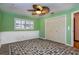 Bedroom with green walls, white trim, closet, and a ceiling fan at 4124 Winderlakes Dr, Orlando, FL 32835