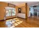 Inviting dining area featuring brick accent wall, wood floors, and natural light at 4124 Winderlakes Dr, Orlando, FL 32835