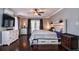 Serene main bedroom featuring hardwood floors, ensuite bath and natural lighting at 4124 Winderlakes Dr, Orlando, FL 32835