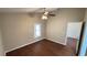 Bedroom with hardwood floors, white trim, and a ceiling fan at 458 Lancers Dr, Winter Springs, FL 32708