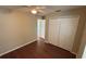 Bedroom with hardwood floors, ceiling fan, and a built-in closet at 458 Lancers Dr, Winter Springs, FL 32708