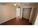 Bedroom with hardwood floors, ceiling fan, and closet with open doors at 458 Lancers Dr, Winter Springs, FL 32708