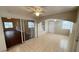 Sunroom featuring tile flooring, an archway to the living area, and access to the outside at 458 Lancers Dr, Winter Springs, FL 32708