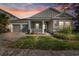 Charming single-story home with a manicured lawn, two-car garage, and welcoming front porch at 4789 Terrace Bluff St, Winter Garden, FL 34787