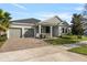 Beautiful single-Gathering home with a two-car garage, a cozy front porch, and a well-kept lawn at 4789 Terrace Bluff St, Winter Garden, FL 34787