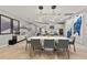 A bright kitchen visible from the dining area, featuring modern appliances and a large center island at 4789 Terrace Bluff St, Winter Garden, FL 34787