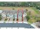 Aerial shot of townhomes, highlighting the property's layout, landscaping, and desirable location at 4816 Cliveden Loop, Sanford, FL 32773