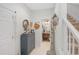 Hallway featuring a powder room, decorative accessories and staircase to the second level at 4816 Cliveden Loop, Sanford, FL 32773