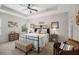 Comfortable main bedroom with a tray ceiling, ceiling fan, and ample natural light at 4816 Cliveden Loop, Sanford, FL 32773