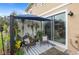 Cozy patio seating area with plants and an umbrella at 4816 Cliveden Loop, Sanford, FL 32773