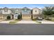 Charming townhomes showcasing a modern exterior with well-maintained lawns and inviting curb appeal at 4816 Cliveden Loop, Sanford, FL 32773