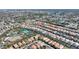 Community aerial view featuring tile roofs, landscaping, and resort style community pool, tennis court, and clubhouse at 5234 Wildwood Way, Davenport, FL 33837